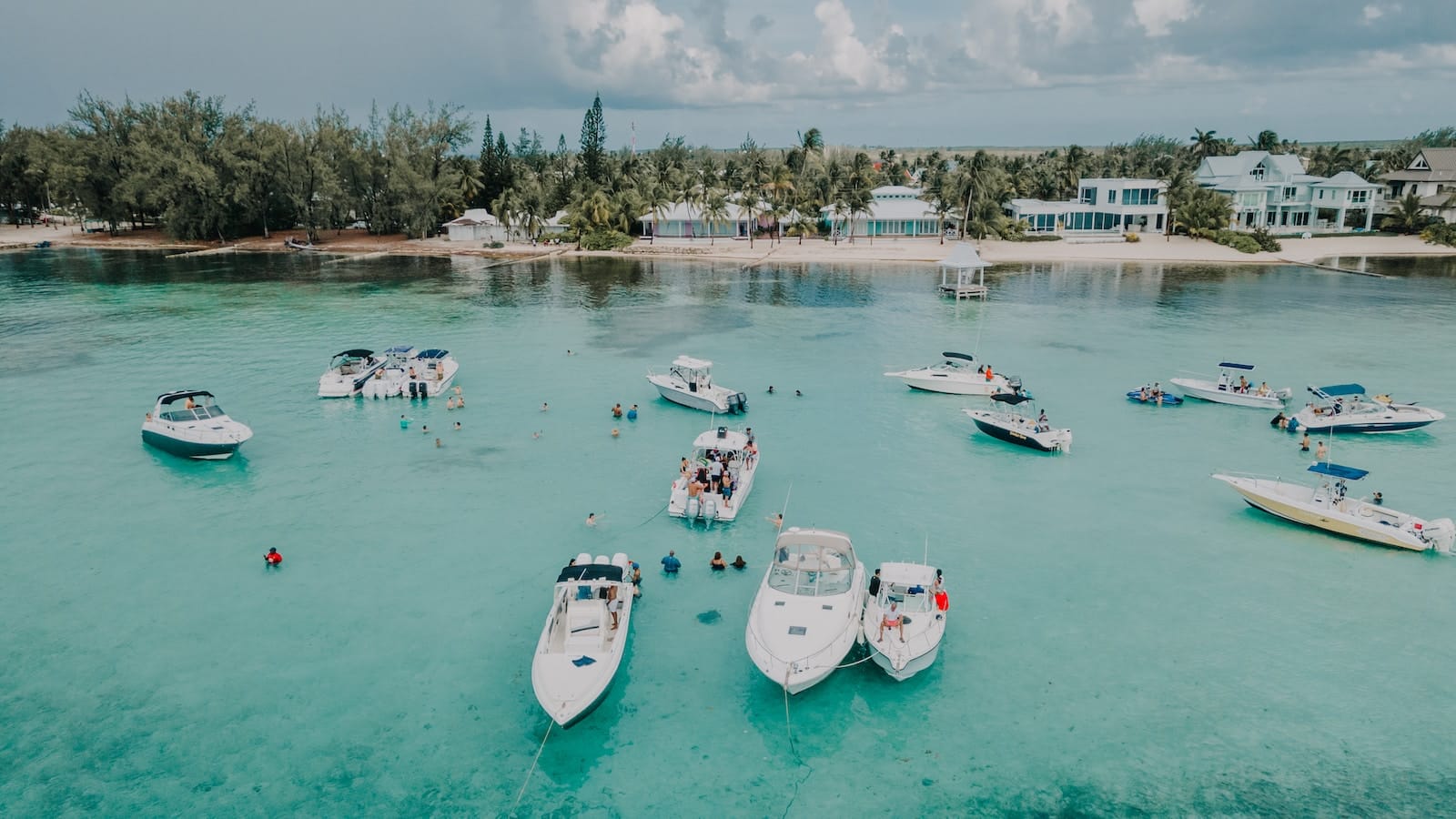 white and blue boats on sea during daytime